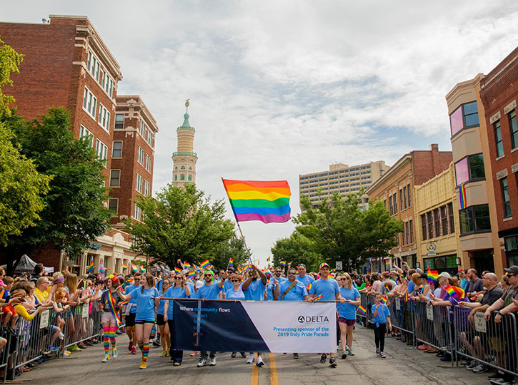 DFC employees march down Mass Ave during the pride parade