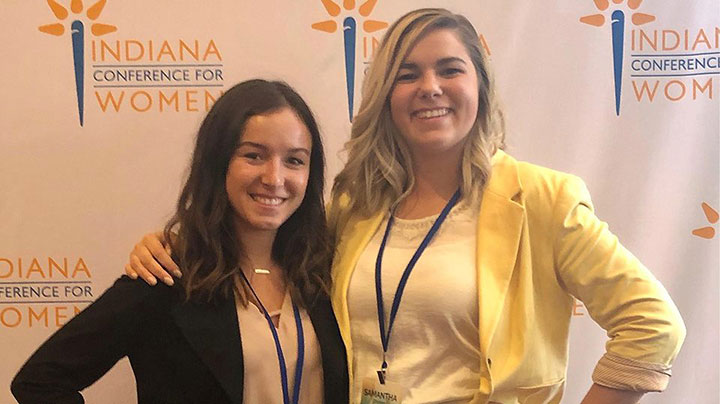 Two Delta employees pose for a picture